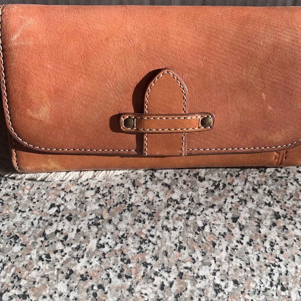 Brown leather Frye wallet. Used a hand full of times.